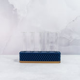 "Front view of empty MIDNIGHT Propagation Station, displaying five clear tubes in a gold block with deep navy accents."